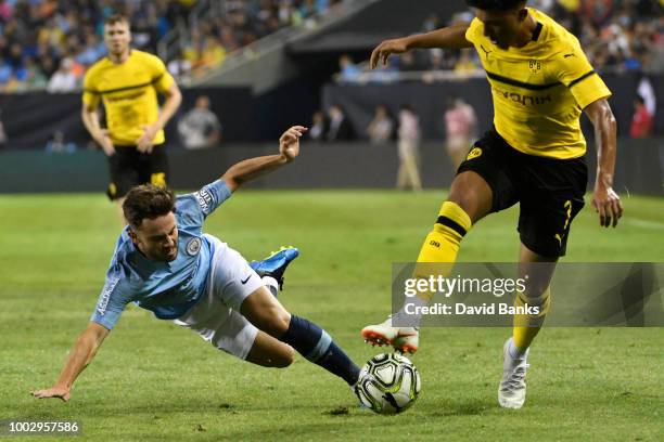 Jadon Sancho of Borussia Dortmund and Patrick Roberts of Manchester City go for the ball on July 20, 2018 at Soldier Field in Chicago, Illinois....