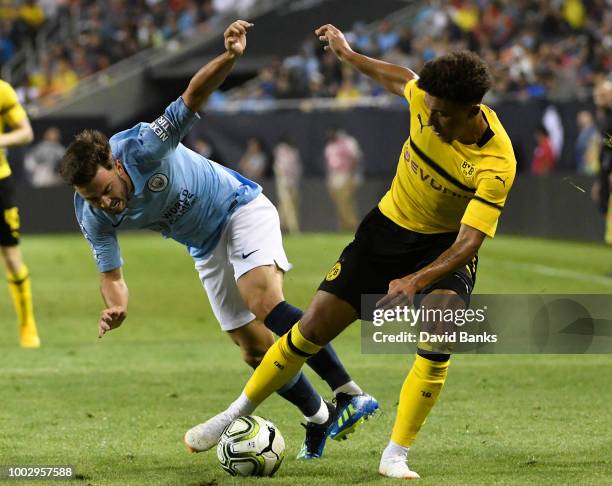 Jadon Sancho of Borussia Dortmund and Patrick Roberts of Manchester City go for the ball on July 20, 2018 at Soldier Field in Chicago, Illinois....