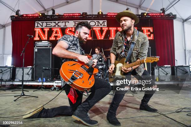 Jordan Merrigan and Tom Salin perform with Dylan Schneider at Michigan International Speedway on July 20, 2018 in Brooklyn, Michigan.