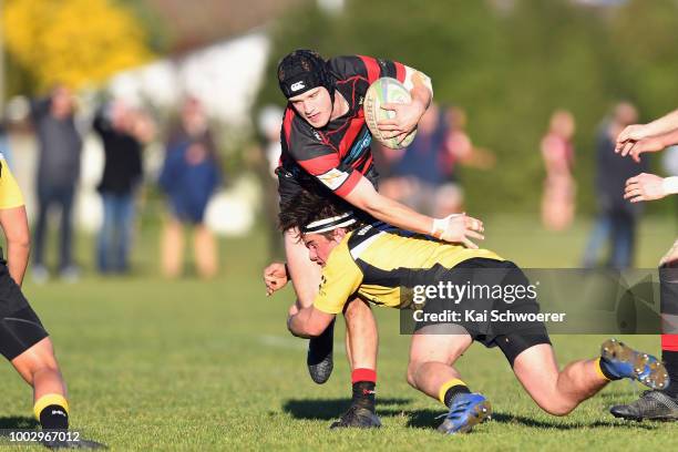 Zachary McKay of Christchurch is tackled during the Hawkins Metro Premier Trophy Semi Final match between Christchurch FC and New Brighton RFC on...