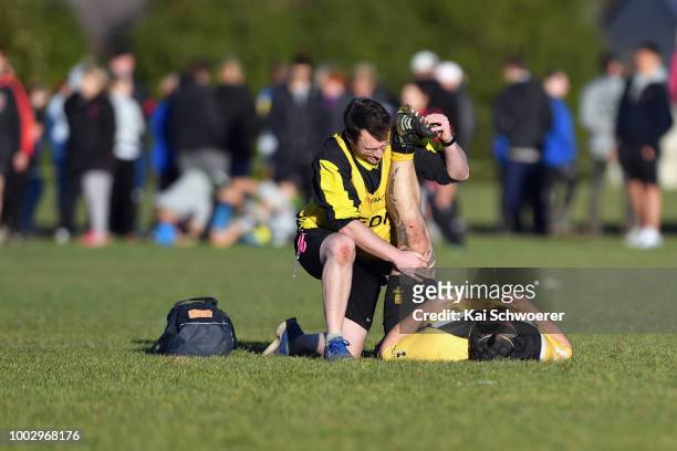 Nikos Cummings-Toone of New Brighton receives medical help during the Hawkins Metro Premier Trophy Semi Final match between Christchurch FC and New...