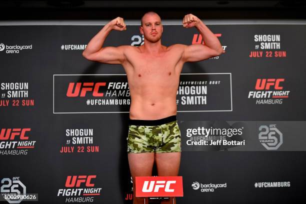 Stefan Struve of The Netherlands poses on the scale during the UFC Fight Night Weigh-in event at the Radisson Blu Hotel on July 21, 2018 in Hamburg,...