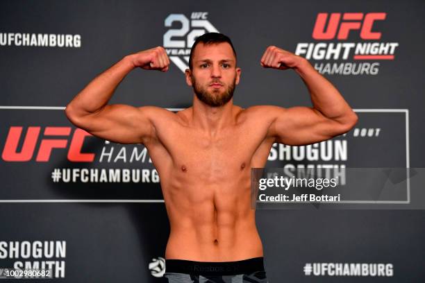 David Zawada of England poses on the scale during the UFC Fight Night Weigh-in event at the Radisson Blu Hotel on July 21, 2018 in Hamburg, Germany.