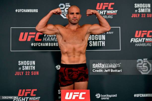 Glover Teixeira of Brazil poses on the scale during the UFC Fight Night Weigh-in event at the Radisson Blu Hotel on July 21, 2018 in Hamburg, Germany.