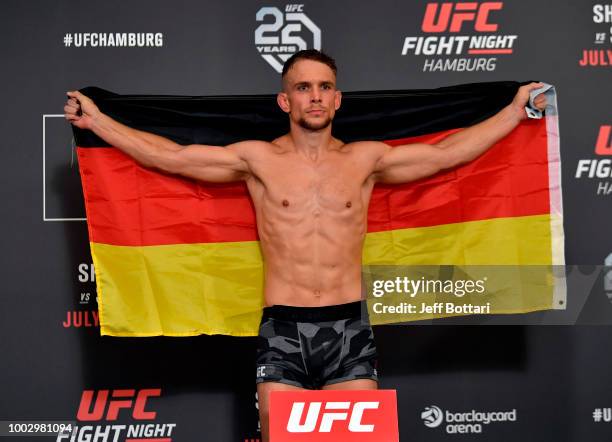 Nick Hein of Germany poses on the scale during the UFC Fight Night Weigh-in event at the Radisson Blu Hotel on July 21, 2018 in Hamburg, Germany.