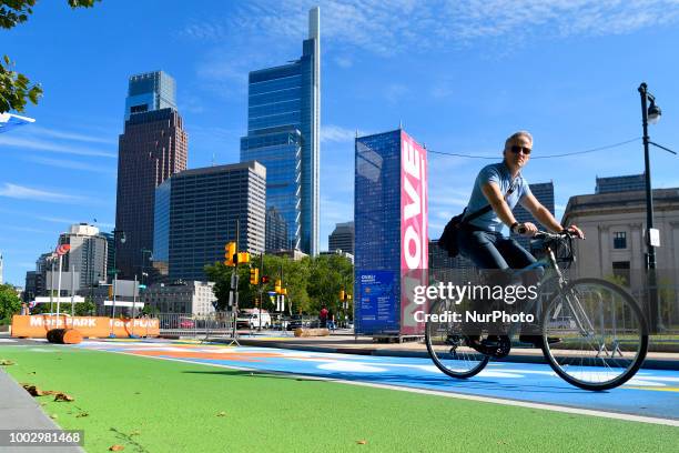 Male cyclist rides over a closed section of the the Benjamin Franklin Parkway as community members celebrate summer at the Oval, in Philadelphia, PA...