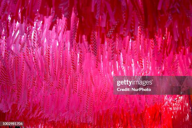 Ribbons hang from a frame and move to the wind as community members celebrate summer at the Oval, on the Benjamin Franklin Parkway, in Philadelphia,...