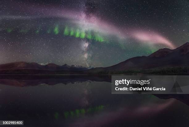 steve (steve (atmospheric phenomenon), northern lights and milky way over the patricia lake in jasper national park, alberta, canada. - light natural phenomenon stock pictures, royalty-free photos & images