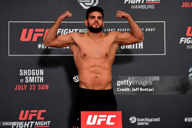 Nasrat Haqparast of Germany poses on the scale during the UFC Fight Night Weigh-in event at the Radisson Blu Hotel on July 21, 2018 in Hamburg,...