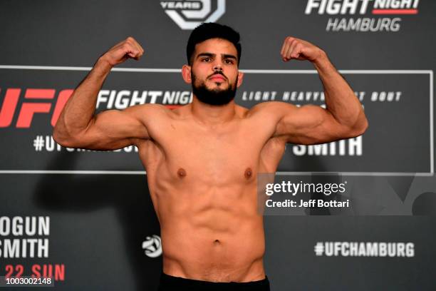 Nasrat Haqparast of Germany poses on the scale during the UFC Fight Night Weigh-in event at the Radisson Blu Hotel on July 21, 2018 in Hamburg,...