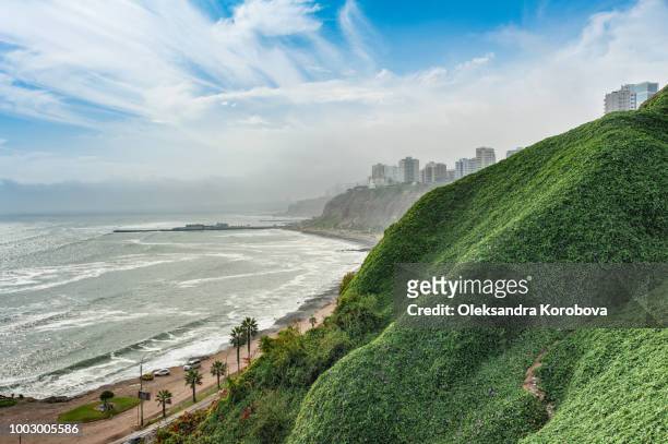 the beach along the cliffs of miraflores neighborhood in lima peru. - lima perú stock pictures, royalty-free photos & images