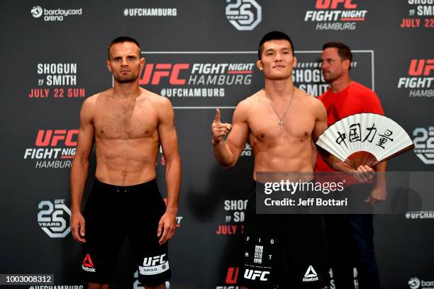 Opponents Damian Stasiak of Poland and Pingyuan Liu of China pose for the media during the UFC Fight Night Weigh-in event at the Radisson Blu Hotel...