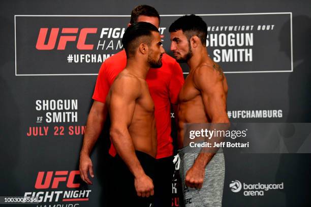 Opponents Khalid Taha of Germany and Nad Narimani of England face off during the UFC Fight Night Weigh-in event at the Radisson Blu Hotel on July 21,...