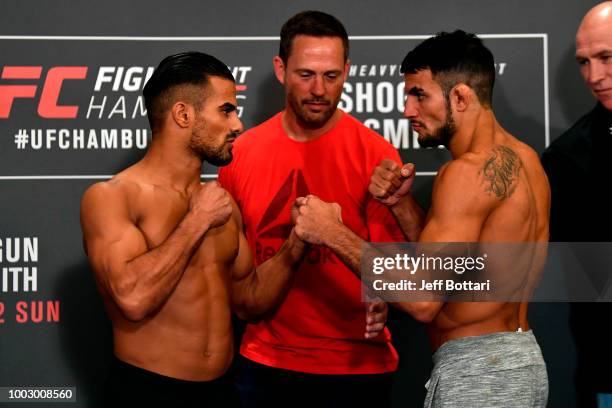 Opponents Khalid Taha of Germany and Nad Narimani of England face off during the UFC Fight Night Weigh-in event at the Radisson Blu Hotel on July 21,...