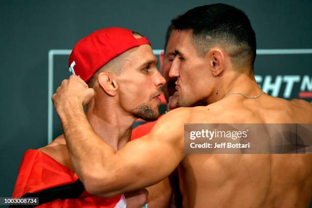 Opponents Nick Hein of Germany and Damir Hadzovic of Bosnia face off during the UFC Fight Night Weigh-in event at the Radisson Blu Hotel on July 21,...