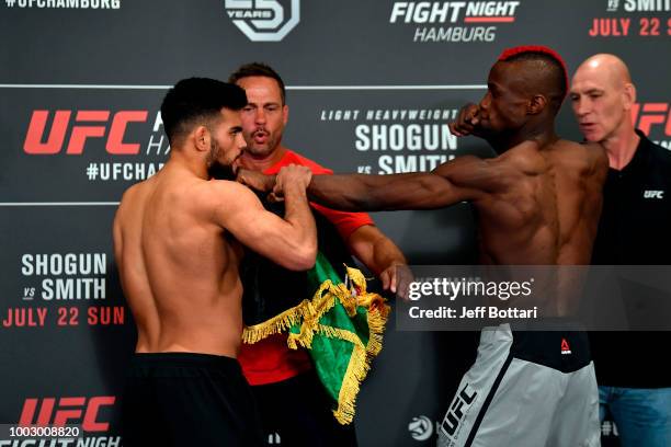 Nasrat Haqparast of Germany and Marc Diakiese of Congo face off during the UFC Fight Night Weigh-in event at the Radisson Blu Hotel on July 21, 2018...