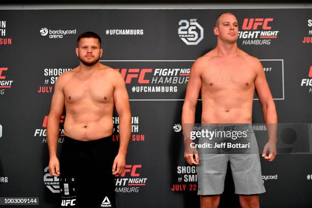 Opponents Marcin Tybura of Poland and Stefan Struve of The Netherlands pose for the media during the UFC Fight Night Weigh-in event at the Radisson...