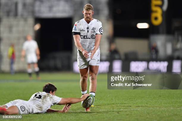 Kobus van Wyk of the Sharks holds the ball as Robert du Preez of the Sharks kicks a penalty kick during the Super Rugby Qualifying Final match...