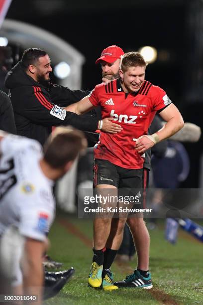 Bryn Hall and Jack Goodhue of the Crusaders celebrate after Braydon Ennor of the Crusaders scored a try during the Super Rugby Qualifying Final match...