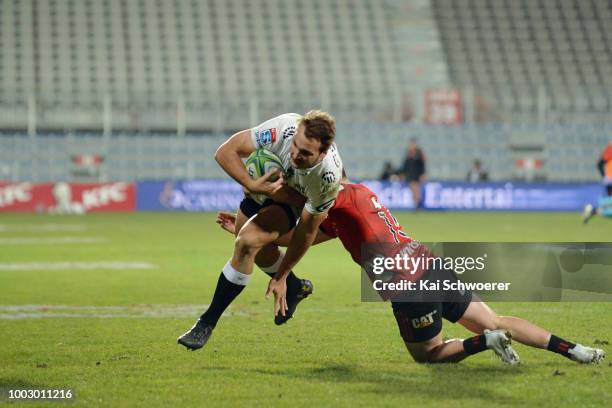 Andre Esterhuizen of the Sharks is tackled during the Super Rugby Qualifying Final match between the Crusaders and the Sharks at AMI Stadium on July...