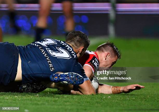 Matt Dufty of the Dragons scores a try during the round 19 NRL match between the North Queensland Cowboys and the St George Illawarra Dragons at...