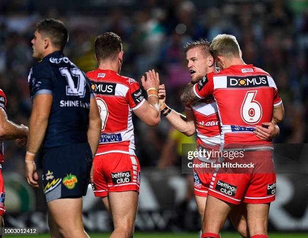 Matt Dufty of the Dragons celebrates after scoring a try during the round 19 NRL match between the North Queensland Cowboys and the St George...