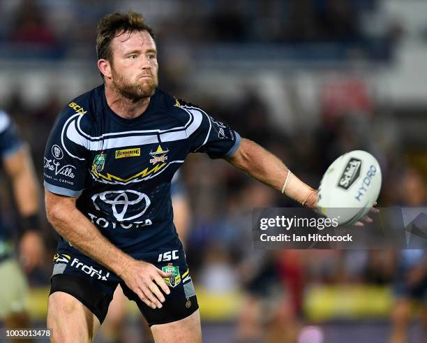 Gavin Cooper of the Cowboys passes the ball during the round 19 NRL match between the North Queensland Cowboys and the St George Illawarra Dragons at...