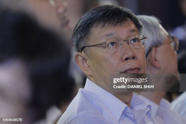 Taipei mayor Ko Wen-je watches an opera performance in Taipei on July 21, 2018.