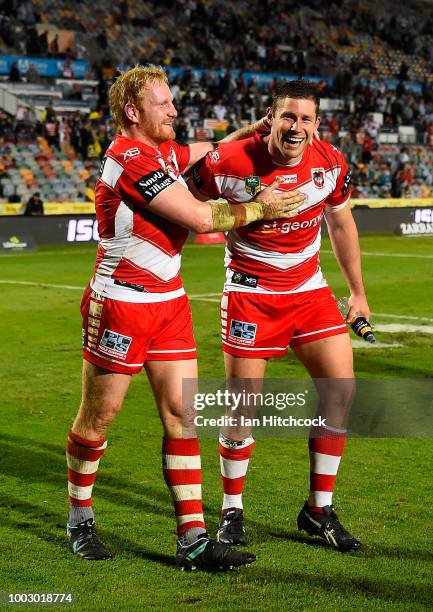 James Graham and Jeremy Latimore celebrate after winning the round 19 NRL match between the North Queensland Cowboys and the St George Illawarra...