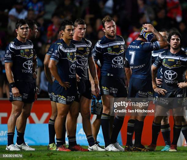 The Cowboys stand in the in-goal area waiting for a conversion attempt during the round 19 NRL match between the North Queensland Cowboys and the St...