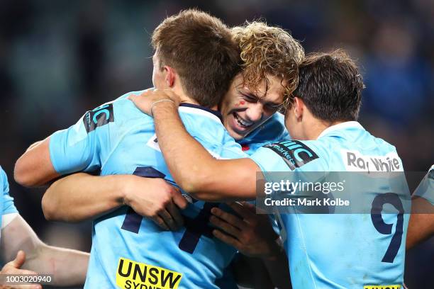 Alex Newsome, Ned Hanigan and Nick Phipps of the Waratahs celebrate victory during the Super Rugby Qualifying match between the Waratahs and the...