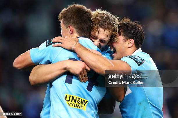 Alex Newsome, Ned Hanigan and Nick Phipps of the Waratahs celebrate victory during the Super Rugby Qualifying match between the Waratahs and the...