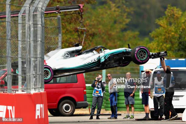 The car of Lewis Hamilton of Great Britain and Mercedes GP is removed from the circuit after stopping during qualifying for the Formula One Grand...