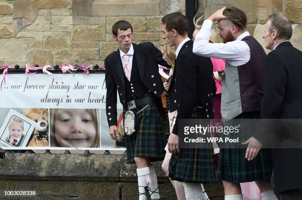 Father Robert MacPhail , mother Georgina Lochrane and Calum MacPhail the funeral of six-year-old Alesha MacPhail at the Coats Funeral Home on July...