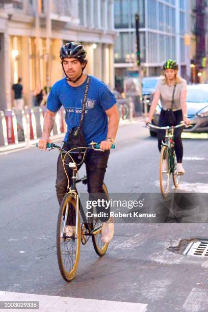 Joe Jonas and Sophie Turner seen out cycling in Manhattan on July 20, 2018 in New York City.