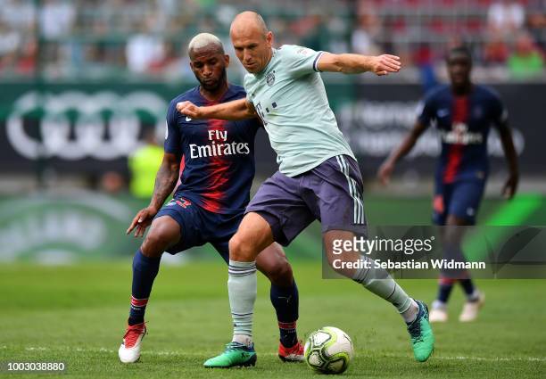 Arjen Robben of Bayern Munich looks to break past the tackle of Kevin Rimane of Paris Saint-German during the International Champions Cup 2018 match...