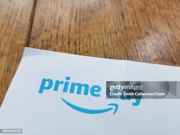 Close-up of logo for Amazon Prime day on a light wooden surface, San Ramon, California, July 18, 2018.