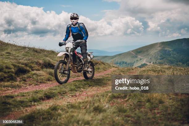 motocross trail rider - motorcycle racing stock pictures, royalty-free photos & images