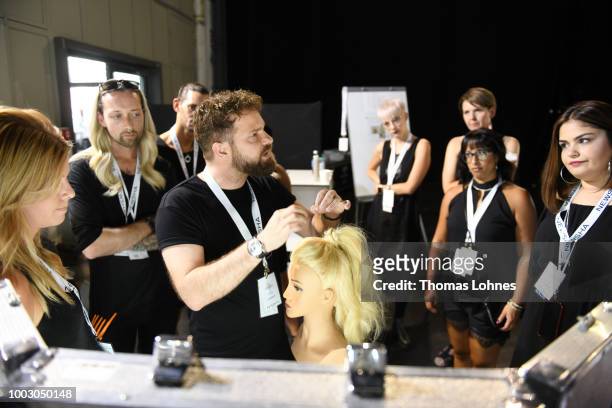 Hair artists work backstage ahead the Fashionyard show during Platform Fashion July 2018 at Areal Boehler on July 21, 2018 in Duesseldorf, Germany.