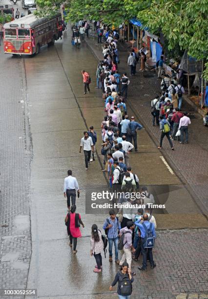 People waiting in line for buses and auto during Nationwide Transport Strike at Andheri, on July 20, 2018 in Mumbai, India. The All India Motor...