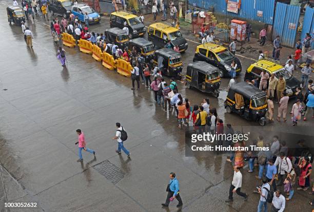 People waiting in line for buses and auto during Nationwide Transport Strike at Andheri, on July 20, 2018 in Mumbai, India. The All India Motor...