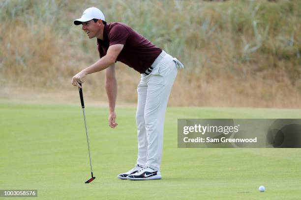 Rory McIlroy of Northern Ireland reacts to a missed putt on the first green during the third round of the 147th Open Championship at Carnoustie Golf...