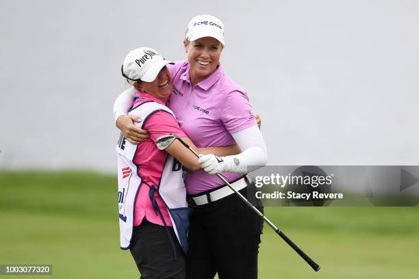 Brittany Lincicome celebrates an eagle with her caddie Missy Pederson on the 17th hole during a continuation of the second round of the Barbasol...