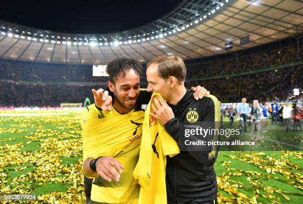 Dortmund's coach Thomas Tuchel and player Pierre-Emerick Aubameyang celebrate after the German DFB Cup final soccer match between Eintracht Frankfurt...