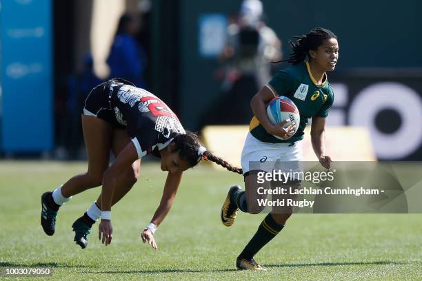 Kimico Manuel of South Africa breaks a tackle to score a try against Mexico during day two of the Rugby World Cup Sevens at AT&T Park on July 21,...