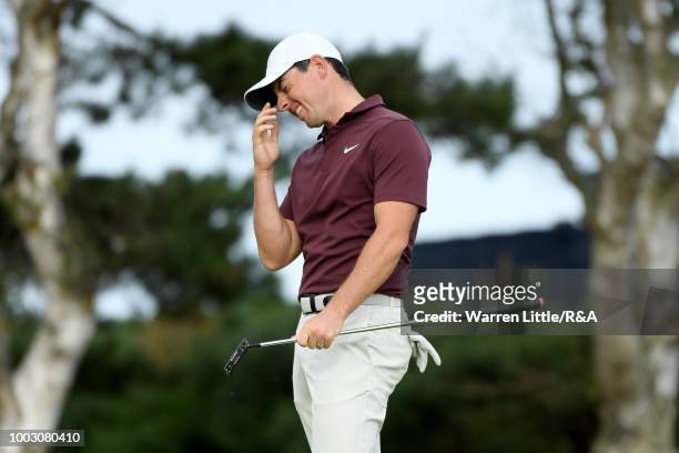 Rory McIlroy of Northern Ireland reacts to putt on the 13th hole green during round three of the Open Championship at Carnoustie Golf Club on July...