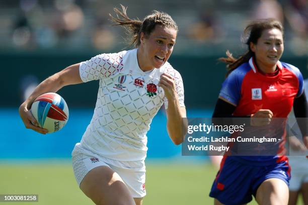 Emily Scarratt of England runs away to score a try against China during day two of the Rugby World Cup Sevens at AT&T Park on July 21, 2018 in San...