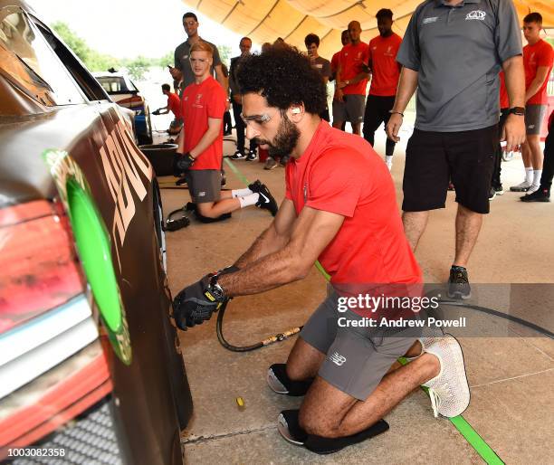 Mohamed Salah of Liverpool changing tyres during a tour of Roush Fenway Racing on July 21, 2018 in Charlotte, North Carolina.