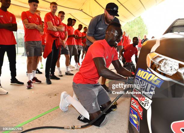 Sadio Mane of Liverpool changing tyres during a tour of Roush Fenway Racing on July 21, 2018 in Charlotte, North Carolina.