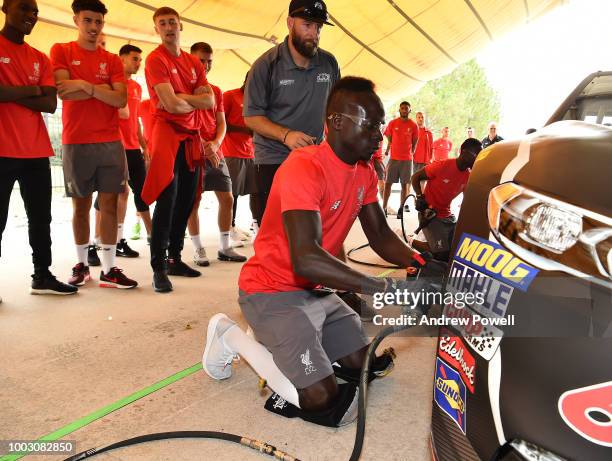 Sadio Mane of Liverpool changing tyres during a tour of Roush Fenway Racing on July 21, 2018 in Charlotte, North Carolina.